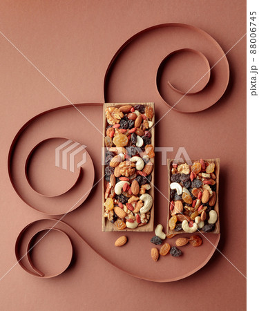 The mix of dried fruits and berries on a brown background. 88006745