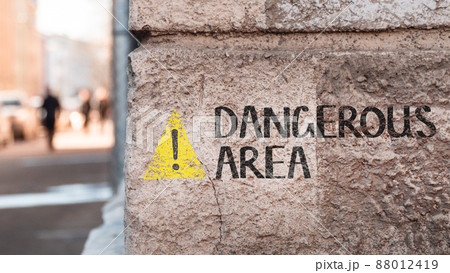 Dangerous area. The inscription on the wall of the building. Dangerous area. The inscription on the wall of the building. 88012419