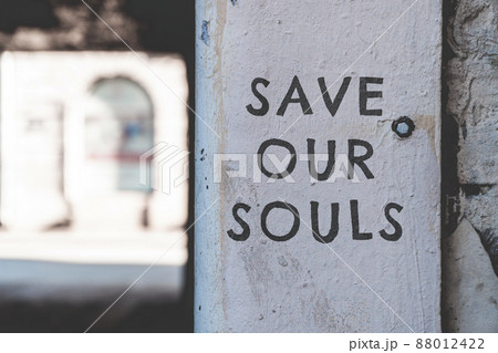 Save our souls. The inscription on the wall of the building. 88012422