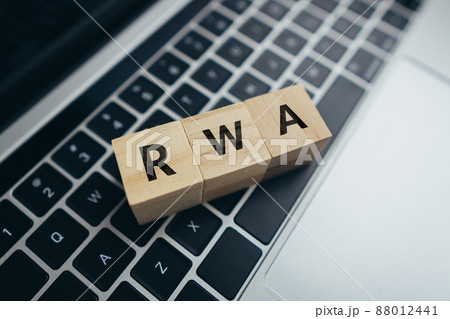 Concept Risk weighted asset or RWA. business acronym. Cubes with letters on a laptop. 88012441