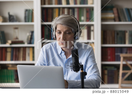 60s woman wear headphones make speech, lead broadcasting on-air 60s woman wear headphones make speech, lead broadcasting on-air 88015049