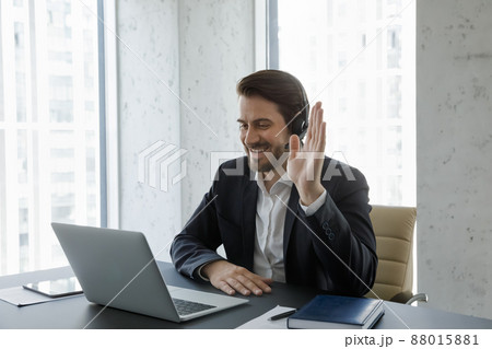 Happy young handsome businessman holding video call. 88015881