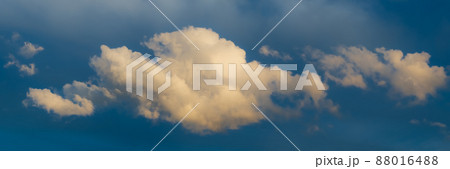 Panoramic view on Sky with dramatic fluffy clouds. White clouds on the sky suitable for background. Cloudy sky. Overcast. Long panoramic Banner. Panoramic view on Sky with dramatic fluffy clouds. White clouds on the sky suitable for background. Cloudy sky. Overcast. Long panoramic Banner. 88016488