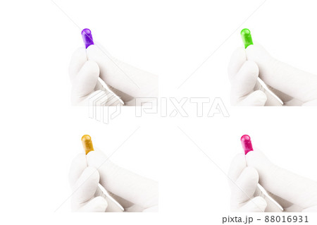 set of hand in medical glove holding colored organic med capsule isolated on white background closeup 88016931