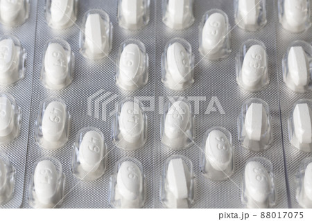 white tablets in blister closeup with selective focus 88017075
