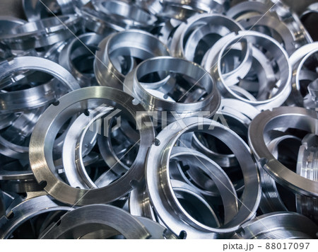 a batch of machined shiny metal parts with selective focus a batch of machined shiny metal parts with selective focus 88017097