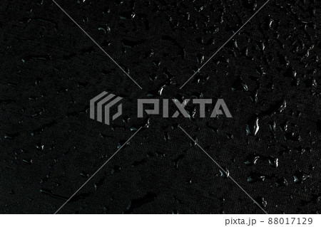 black flat rubber surface with water drops dark macro background black flat rubber surface with water drops dark macro background 88017129