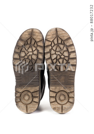 Sole bottom of a pair workboots with acid and oil resistance ability. Isolated on white background. 88017232