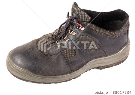 One used blue leather work shoe with fabric incuts isolated on white background One used blue leather work shoe with fabric incuts isolated on white background 88017234