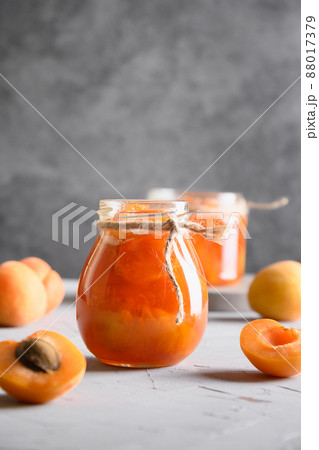 Apricot jam in glass jars. Summer harvest and canned food 88017379
