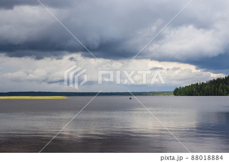Landscape with a boat sailing on the lake 88018884
