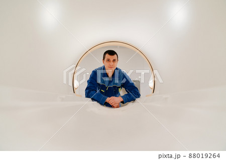 installer engineer of mri apparatus in scanner. blue uniform installer engineer of mri apparatus in scanner. blue uniform 88019264