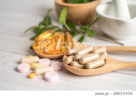 Alternative medicine herbal organic capsule drug with herbs leaf natural supplements for healthy good life. Alternative medicine herbal organic capsule drug with herbs leaf natural supplements for healthy good life. 88025456