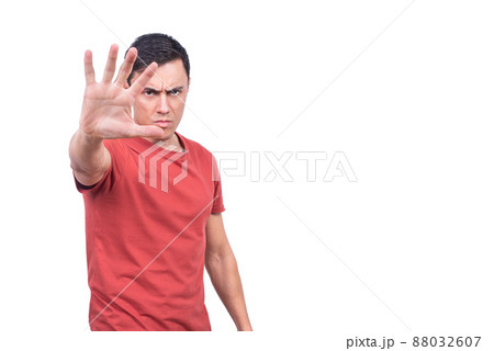 Male model demonstrating stop gesture on white background Male model demonstrating stop gesture on white background 88032607