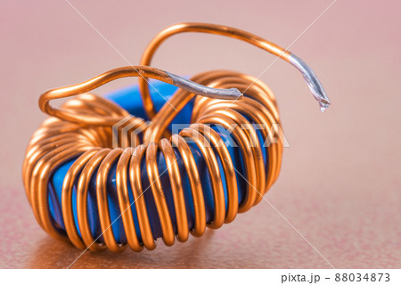 Single electric transformer copper coil close-up 88034873