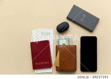 purses with money on a beige background. 88037384