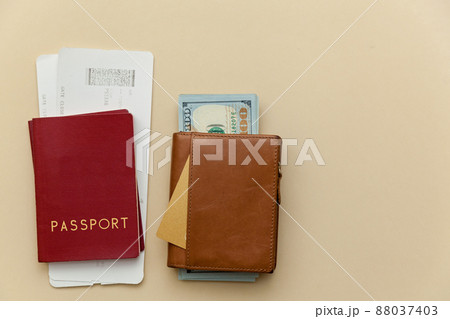 purses with money on a beige background. purses with money on a beige background. 88037403