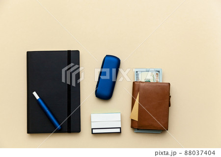 Iqos electronic blue cigarette on a beige background. Iqos electronic blue cigarette on a beige background. 88037404