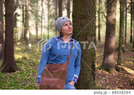 Young woman resting after a walk in the forest 88038294
