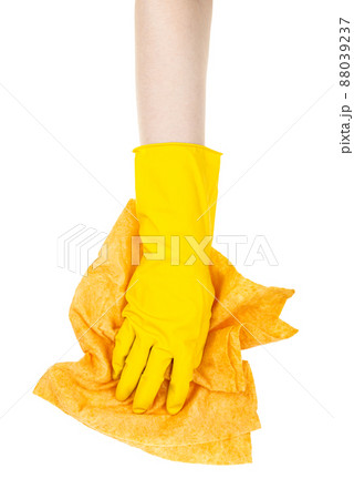 hand in yellow glove wipe with crumpled yellow rag hand in yellow glove wipe with crumpled yellow rag 88039237
