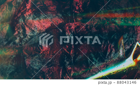 Wrinkled holographic foil texture. Shiny lens flare multicolor background Wrinkled holographic foil texture. Shiny lens flare multicolor background 88043146