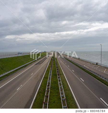 The Afsluitdijk is a major dam and causeway in the Netherlands. It is a fundamental part of the larger Zuiderzee Works, damming off salt water of the North Sea, and turning it into a fresh water lake The Afsluitdijk is a major dam and causeway in the Netherlands. It is a fundamental part of the larger Zuiderzee Works, damming off salt water of the North Sea, and turning it into a fresh water lake 88046784