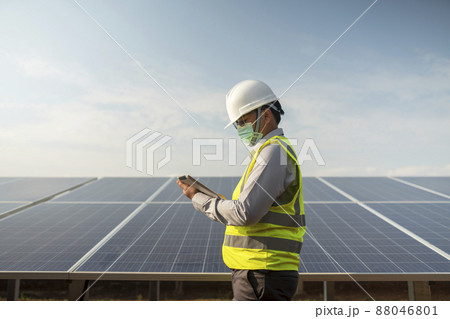 Engineers working to power solar panel renewable power plants in Thailand. 88046801