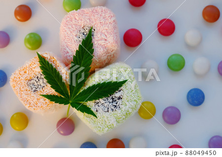 Turkish delight and colorful candy confetti with green cannabis leaf. 88049450