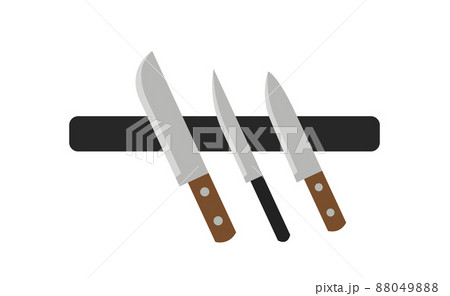 A variety of knives on a magnetic holder. 88049888