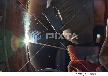 The welder is gaining increased cladding weld The welder is gaining increased cladding weld 88050986