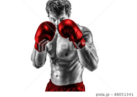 Portrait of boxer in red gloves who stands on white background. Black and white silhouette  88051341