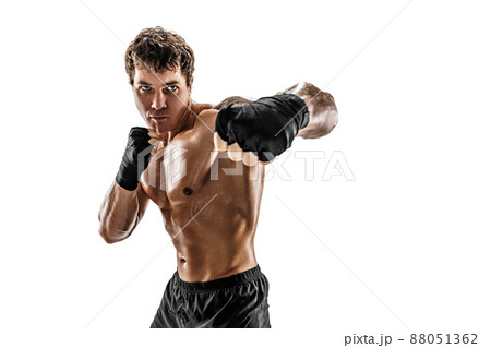 Studio shot of aggressive boxer who training and practicing swing on white background. Sport concept 88051362