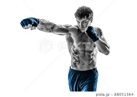 Portrait of boxer who practicing jab on white background. Black and white. Blue sportswear Portrait of boxer who practicing jab on white background. Black and white. Blue sportswear 88051364