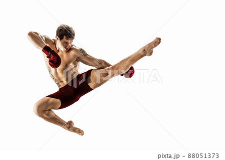 Full size of athlete boxer who perform muay thai martial arts on white background. Red sportswear  88051373