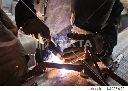 Jointing of large diameter pipes together. Welder performs the tack of stacked pipes 88053092