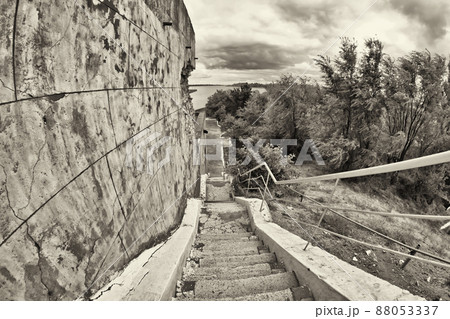 Old stairs with cracked, uneven concrete stairs Old stairs with cracked, uneven concrete stairs 88053337