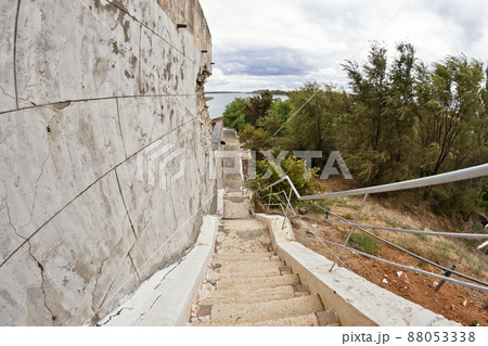 Old stairs with cracked, uneven concrete stairs Old stairs with cracked, uneven concrete stairs 88053338