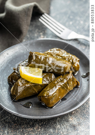 Dolmades. Stuffed vine leaves. Greek appetizer on plate. 88053833