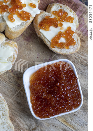 natural red salmon caviar with baguette and butter natural red salmon caviar with baguette and butter 88054475