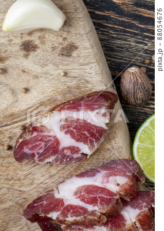 pork and bacon sliced during cooking 88054676