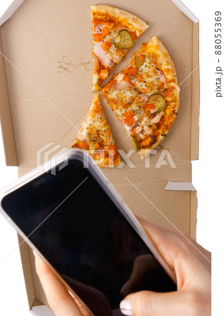 Social media influence millennial hipster photographs the remains of fresh hot pizza Social media influence millennial hipster photographs the remains of fresh hot pizza 88055369