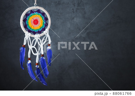 Amulet Dreamcatcher on a black background with free space protecting the sleeper from evil spirits Amulet Dreamcatcher on a black background with free space protecting the sleeper from evil spirits 88061766