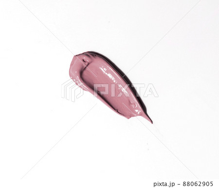 Pink matte lipstick, smear texture on a white background Pink matte lipstick, smear texture on a white background 88062905