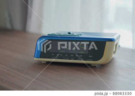 antique black and blue and white radio on wooden floor background, technology, object, copy space antique black and blue and white radio on wooden floor background, technology, object, copy space 88063330