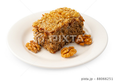 Slice of nut cake isolated on white background Slice of nut cake isolated on white background 88066251