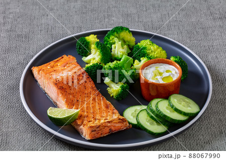 roast salmon fillet with boiled broccoli and sauce roast salmon fillet with boiled broccoli and sauce 88067990
