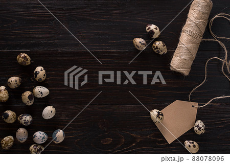 Quail eggs, place for text on dark wooden background top view Quail eggs, place for text on dark wooden background top view 88078096