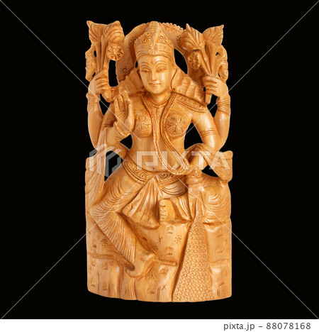 The wooden figure of God, a souvenir gift, India, in isolation 88078168