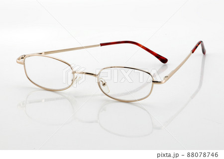 Reading glasses on white background with shadow and differential focus Reading glasses on white background with shadow and differential focus 88078746
