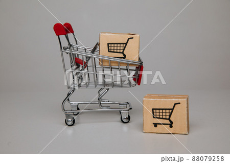 Mini shopping cart with shipping paper boxes. Shopping and delivery concept 88079258